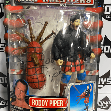ToyBiz Power Slam WCW Wrestlers Roddy Piper with Missile Firing Bag Pipes and Hammer Punching Action Autographed